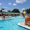 Guests at the Frog Pond Pool enjoy the water on a sunny summer day.